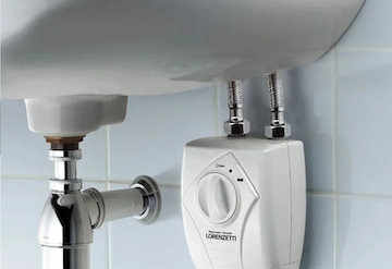 Water heater installation under sink.